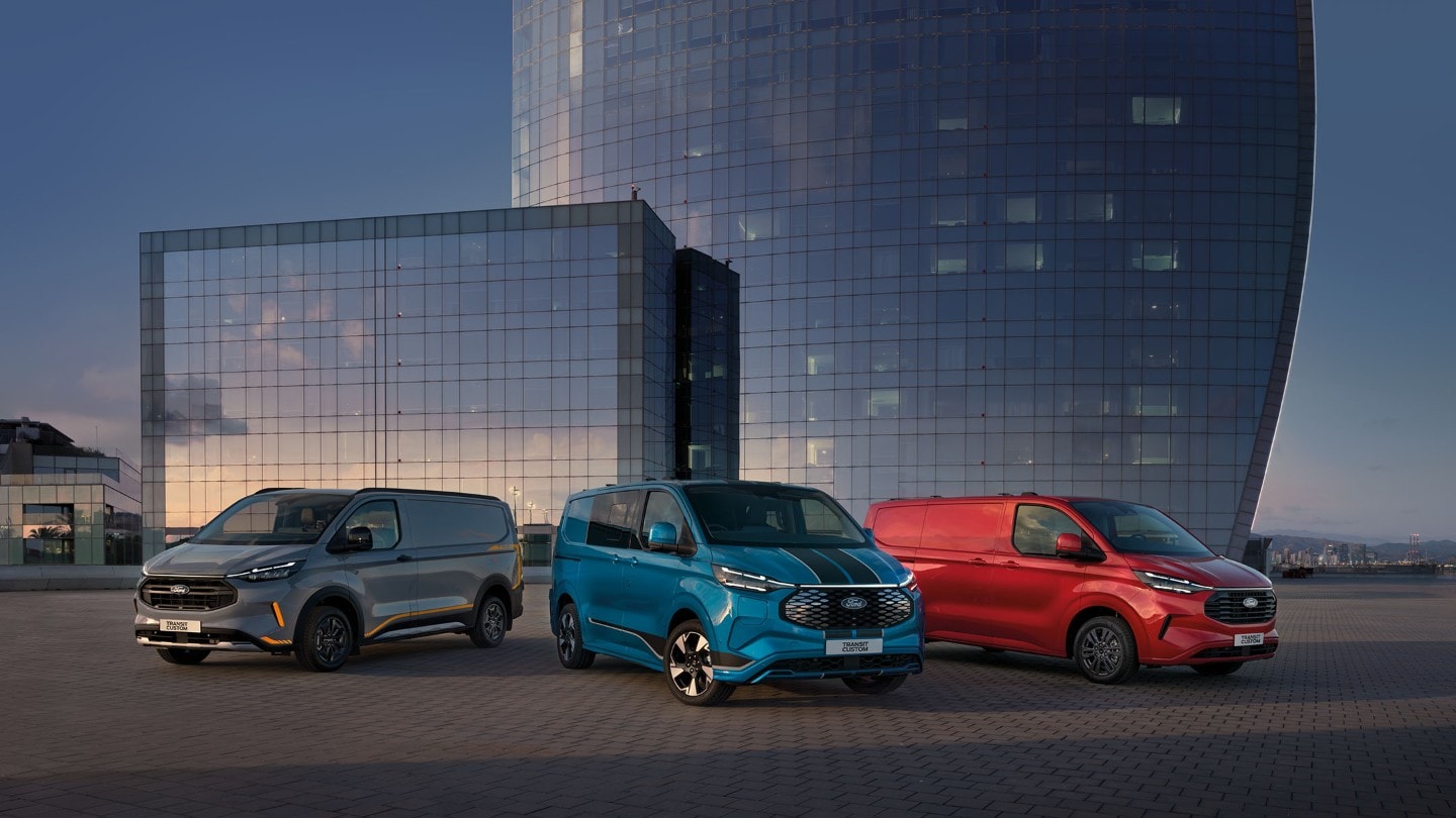 Three Fords parked next to the Buildings