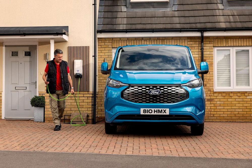 A family having fun while charging their electric Ford Explorer at home.