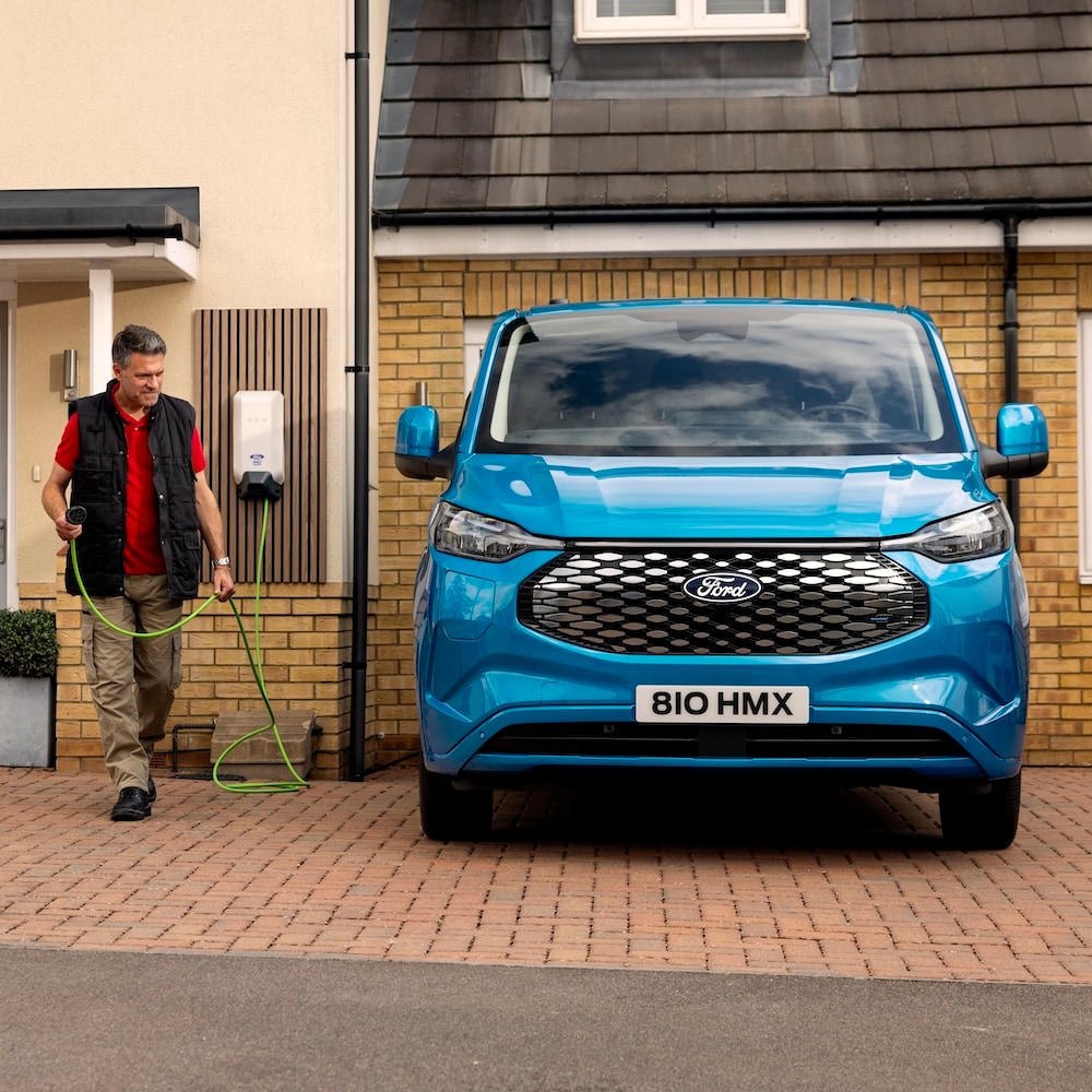A family having fun while charging their electric Ford Explorer at home.