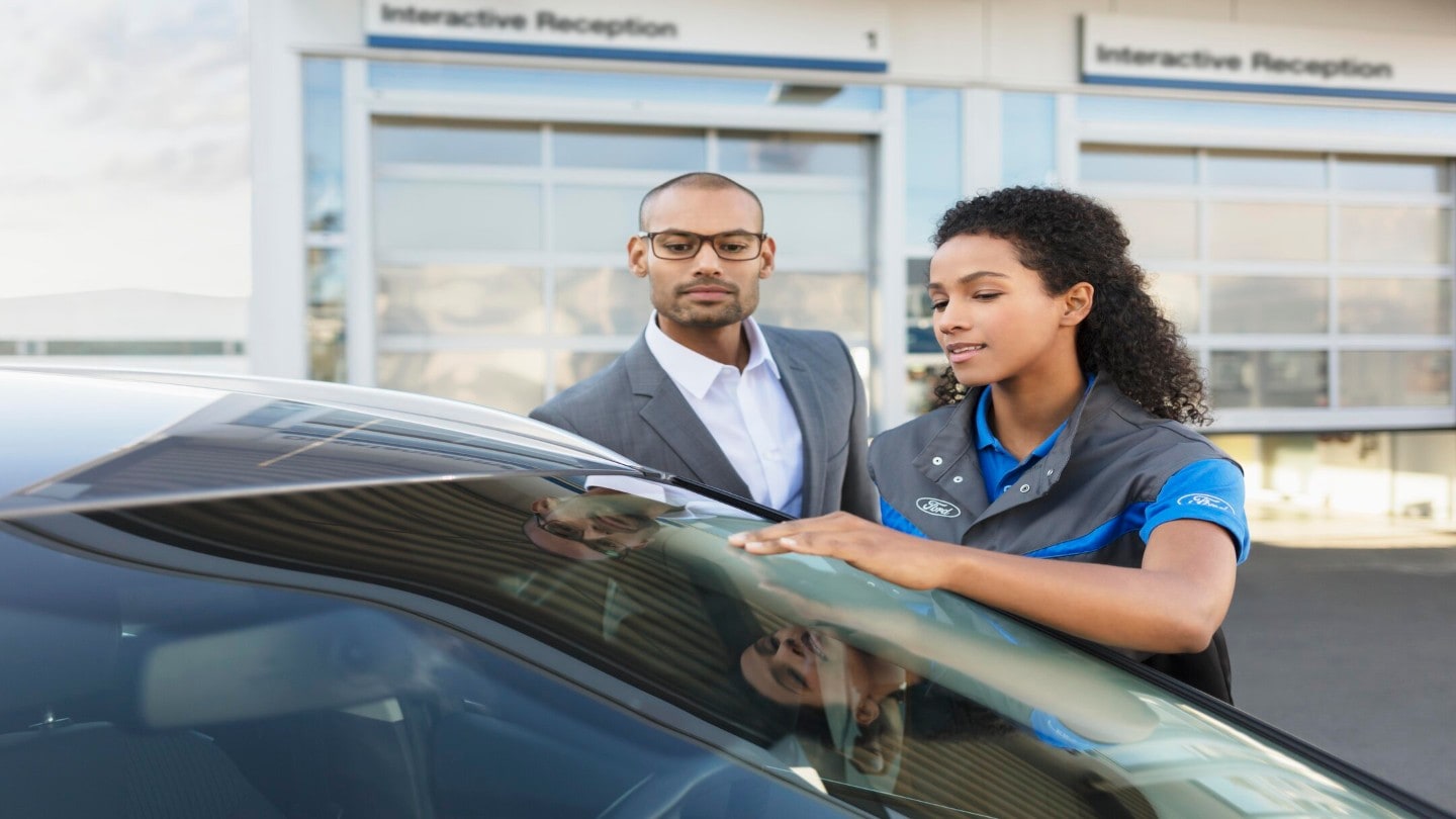 Ford employee showing the car