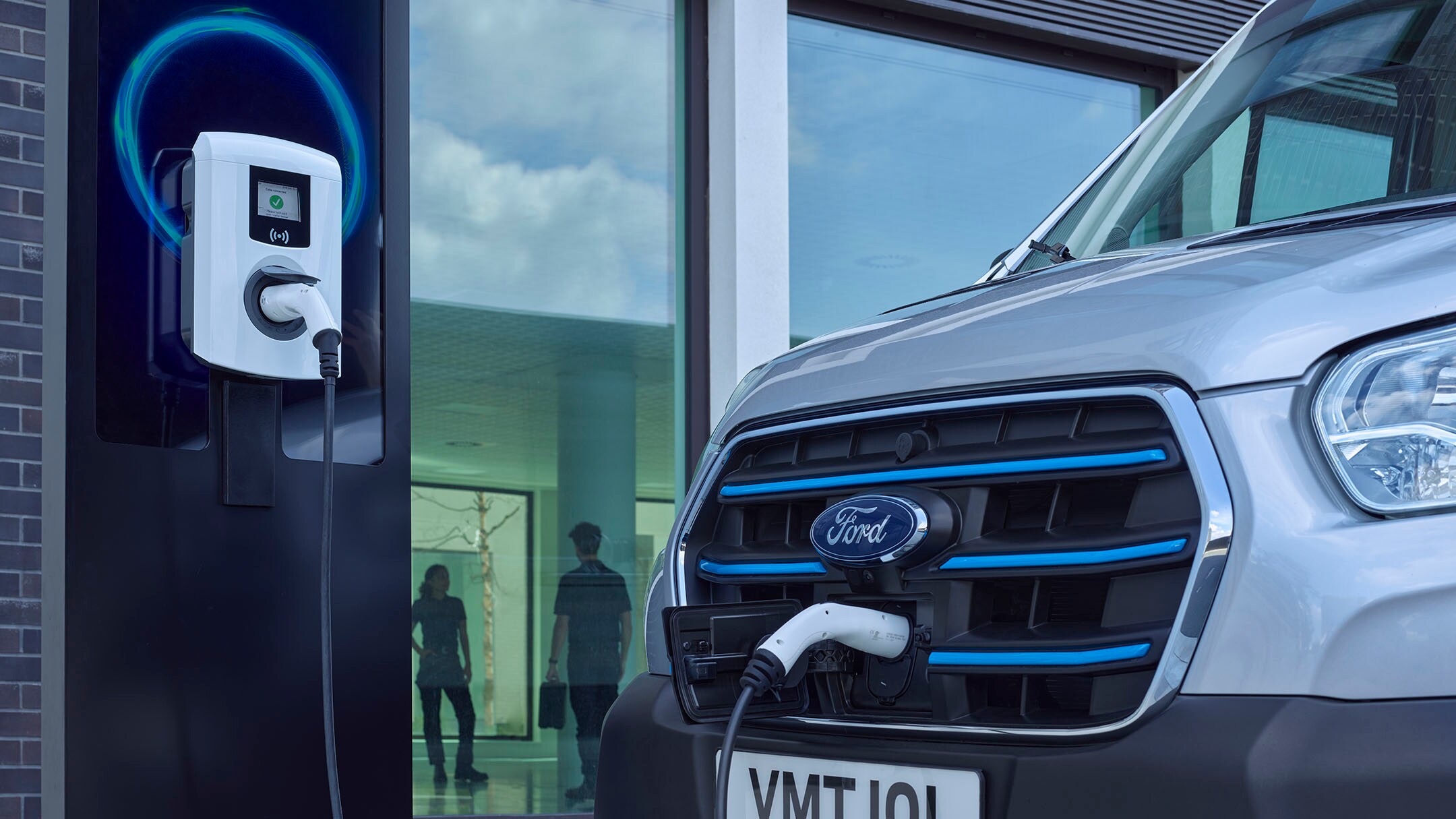 Wall box and Ford Van being charged close up