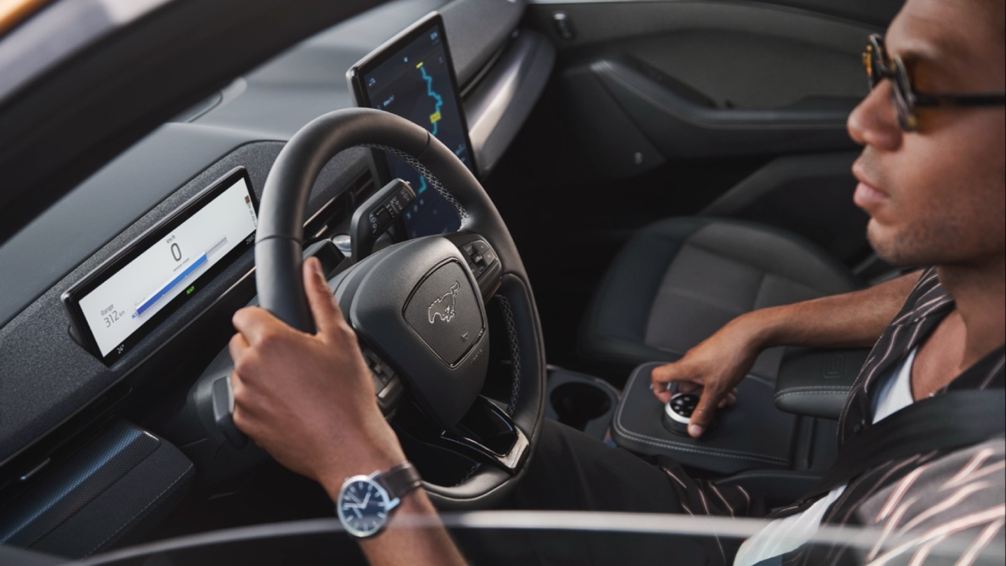 Interior view of person driving in Mach-E