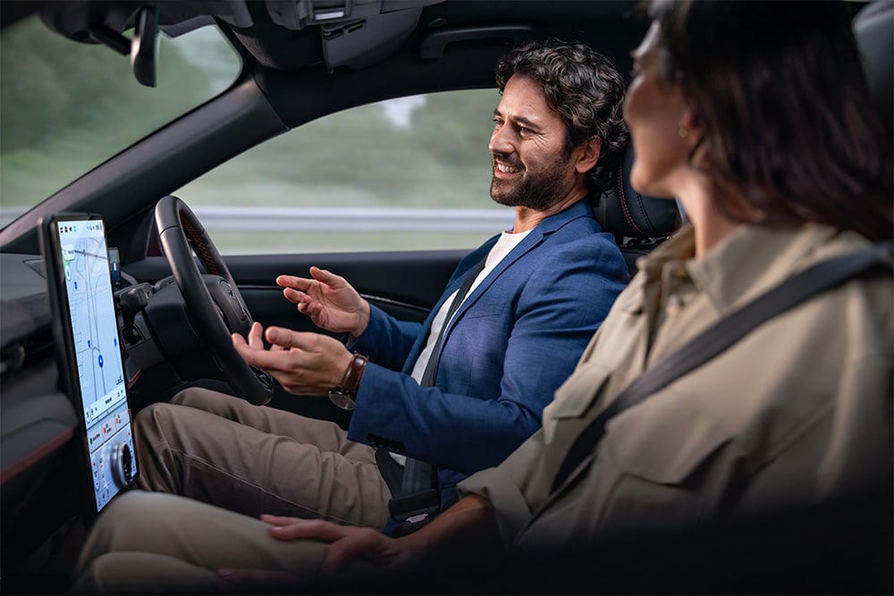 A man driving using Ford BlueCruise