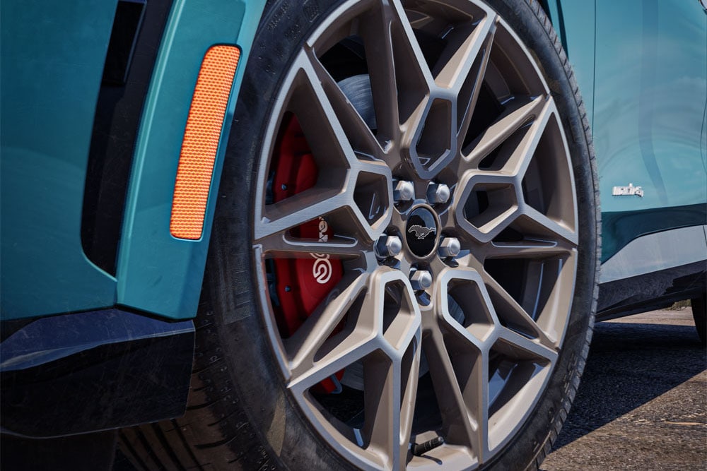 A close-up of the Ford Mustang Mach-E showing the 20" Cast Aluminium Carbonised Grey alloy wheels.