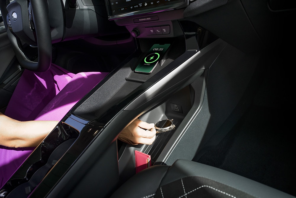 A close up demonstrating the wireless charging and storage stray in the new Ford Puma Gen-E®.