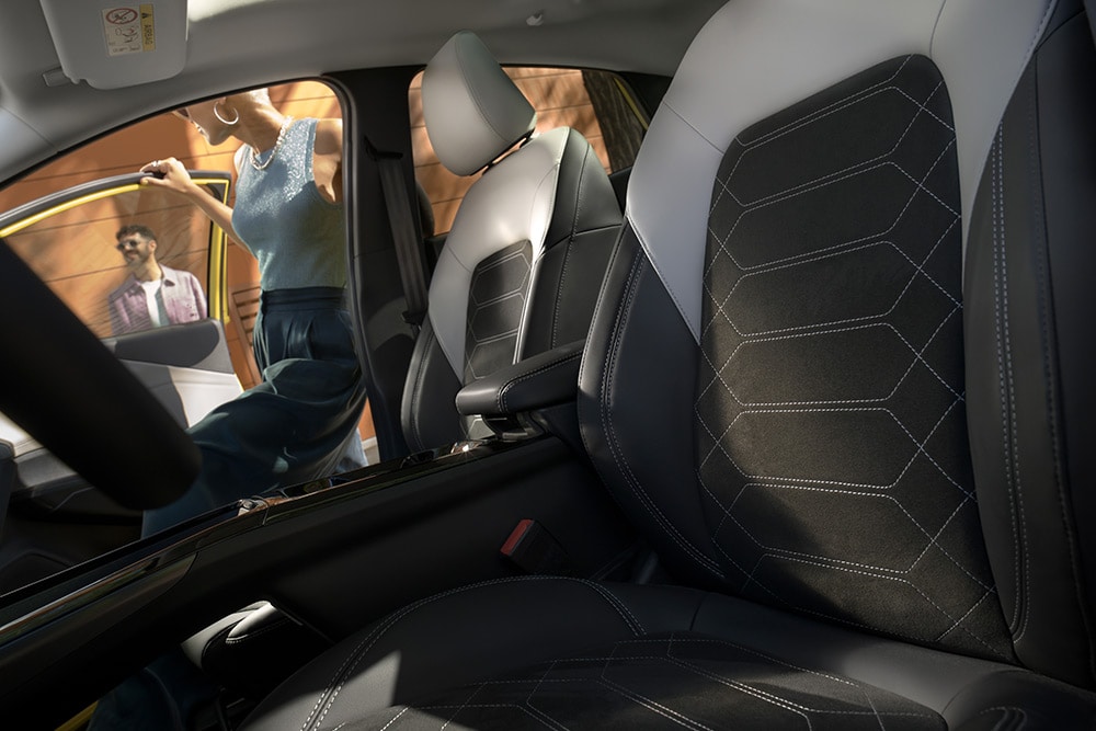 A close up on the black and grey ergonomic seats inside the electric Ford Puma Gen-E®.