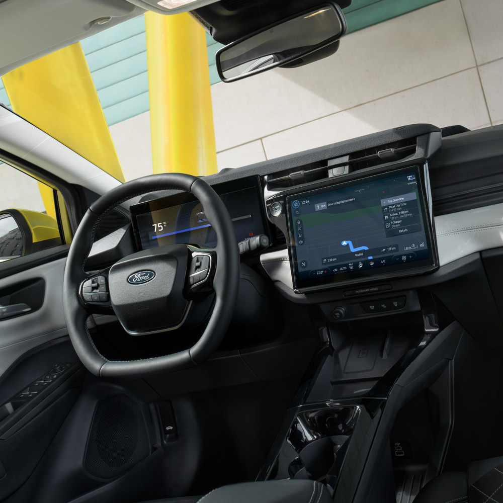 The interior of the new Ford Puma Gen-E®, showing the large touchscreen and Cloud-connected satellite navigation system.