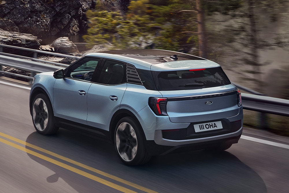 Rear view of the Ford Explorer driving over a bridge