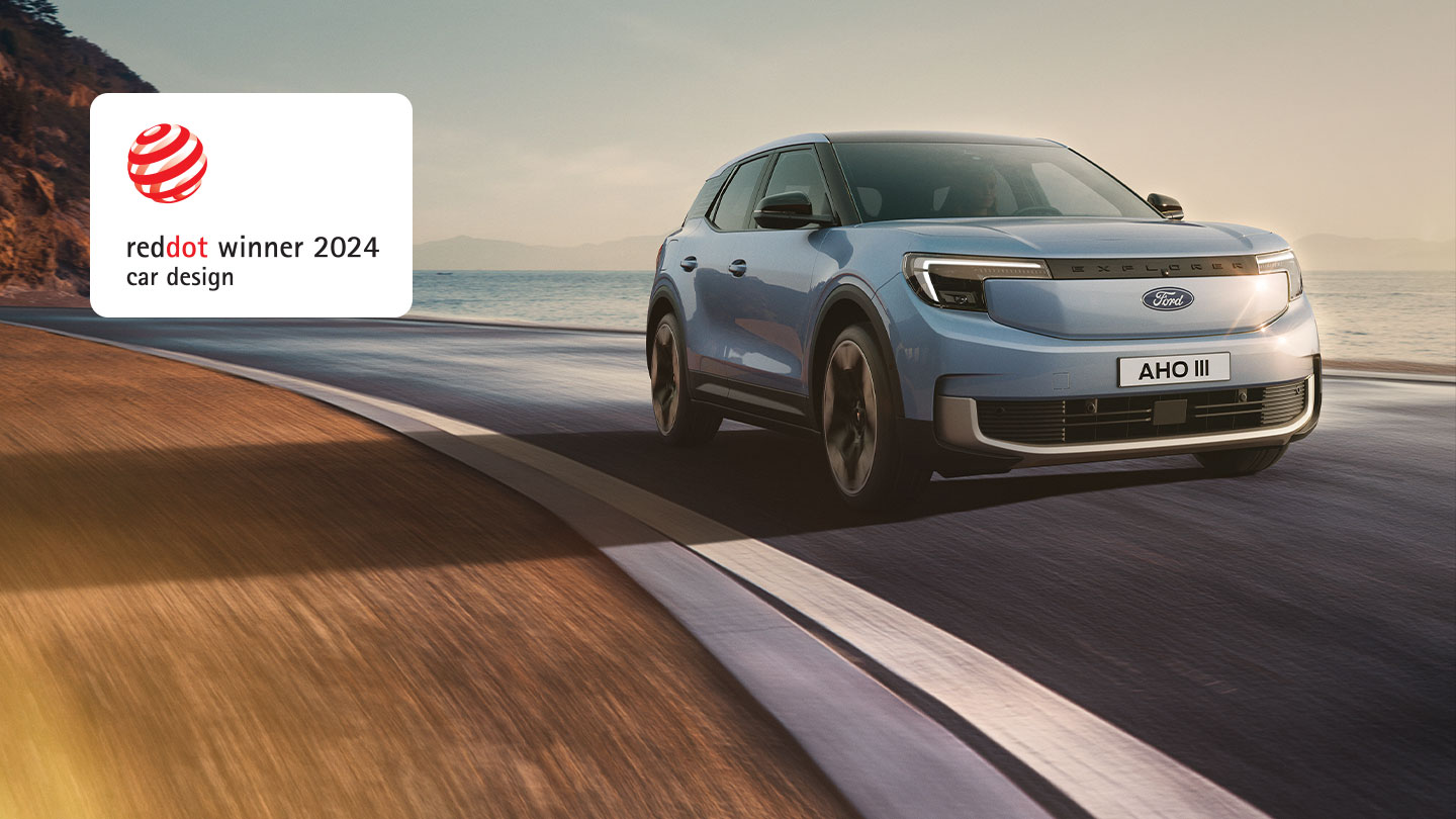 All-electric Ford Explorer on a sea road with the reddot winner 2024 badge