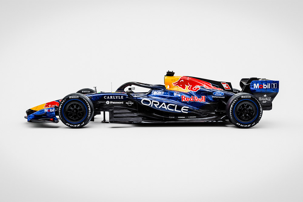 A sleek Red Bull Ford Formula 1 race car on a clean white background with sponsor logos Ford and Red Bull.