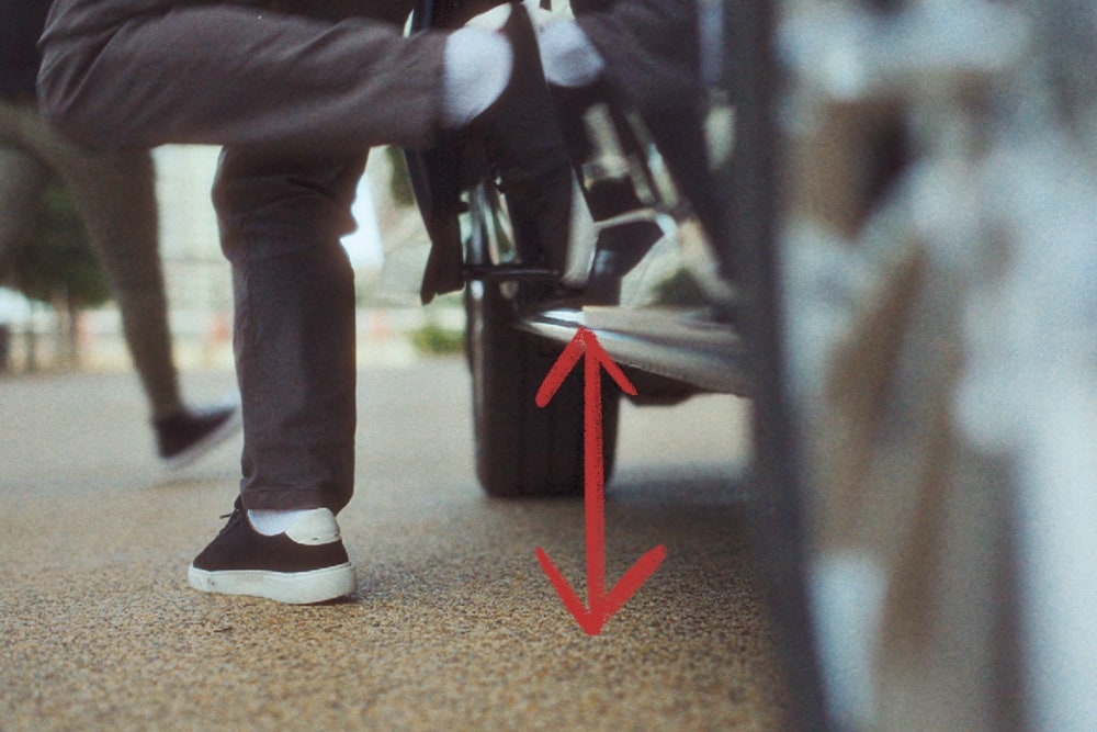 A person steps out of a Ford Tourneo Custom.