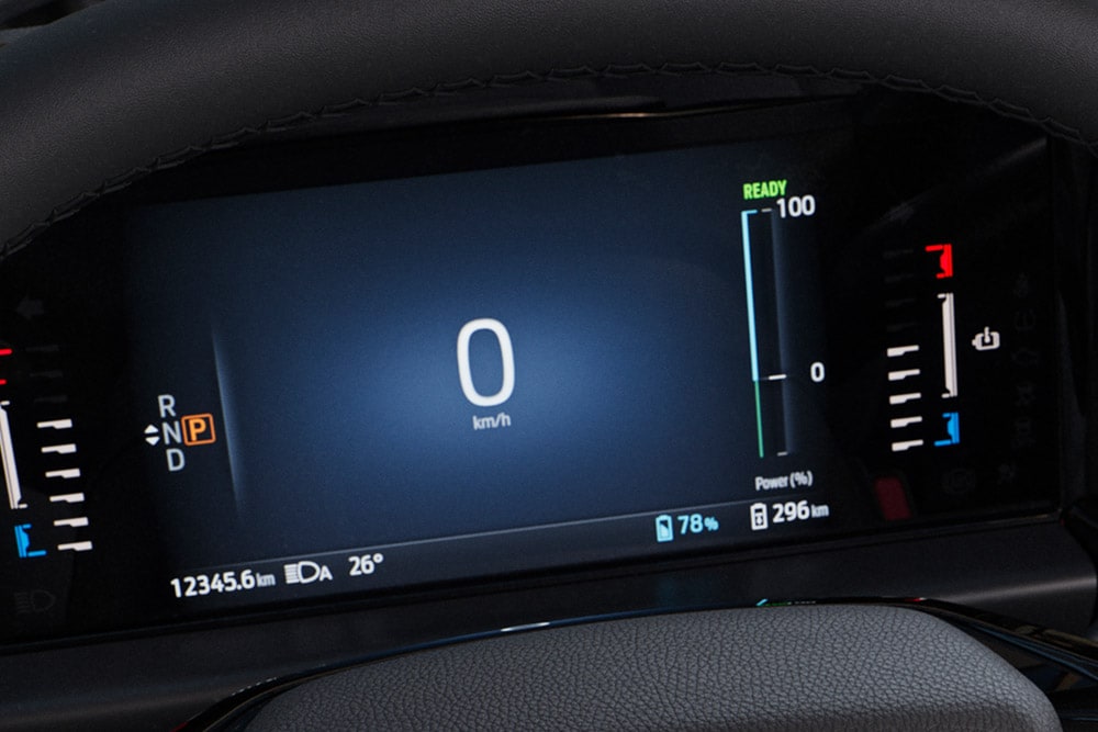 The digital instrument panel of the Ford Tourneo Custom display information including speed, power, and range.