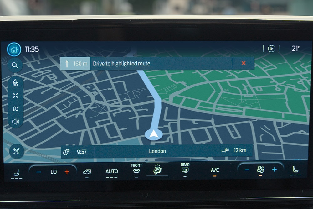 The navigation screen in the Ford Tourneo Custom displays a map with a route highlighted to London.