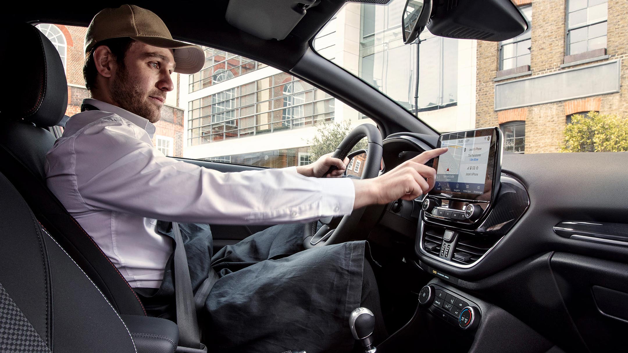 Ford Fiesta Van interior with man using the Ford Sync