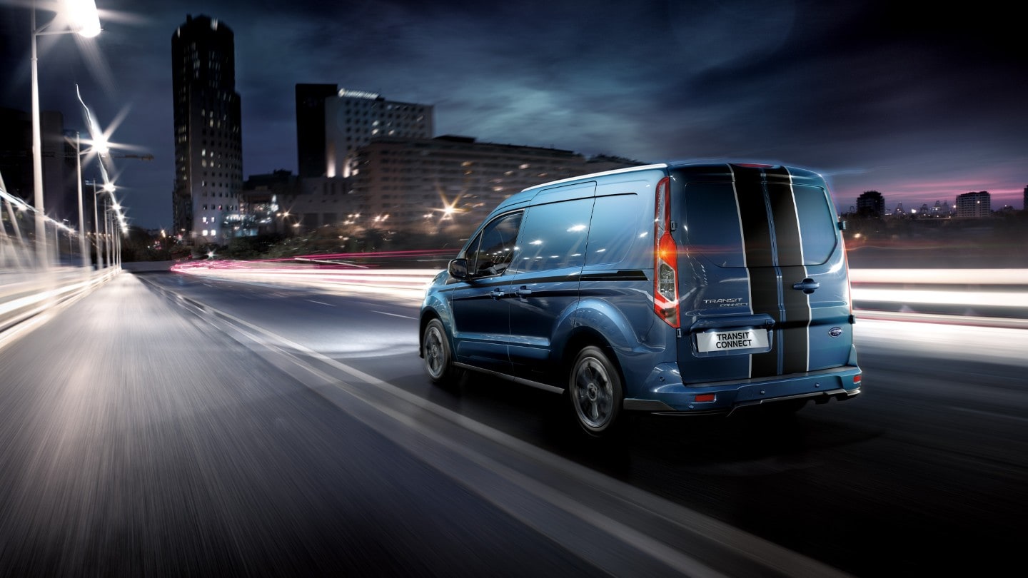 Ford Transit Connect driving at night rear view