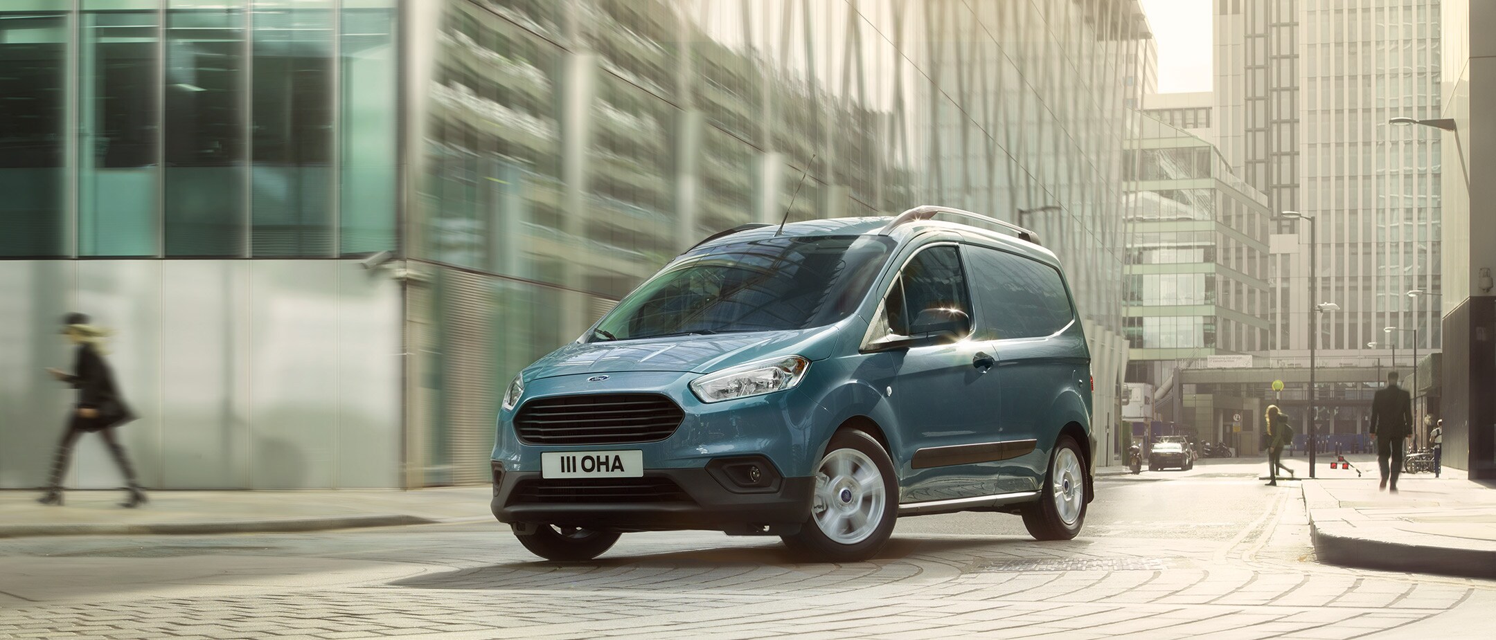 New Ford Transit Courier parked in city street New Ford Transit Courier parked in city street