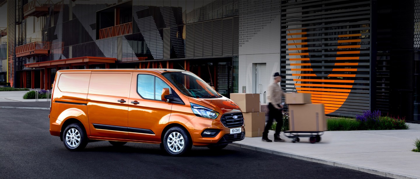 Ford Transit Custom Van parked on street with person doing delivery