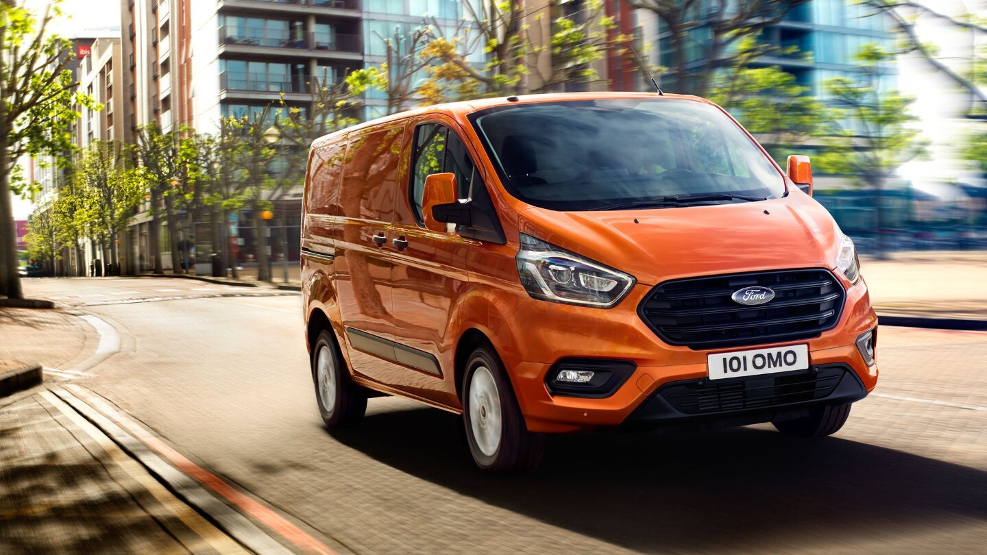 New Orange Ford Transit Custom driving