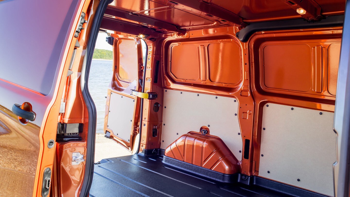 New Orange Ford Transit Custom open loadspace with side and rear doors