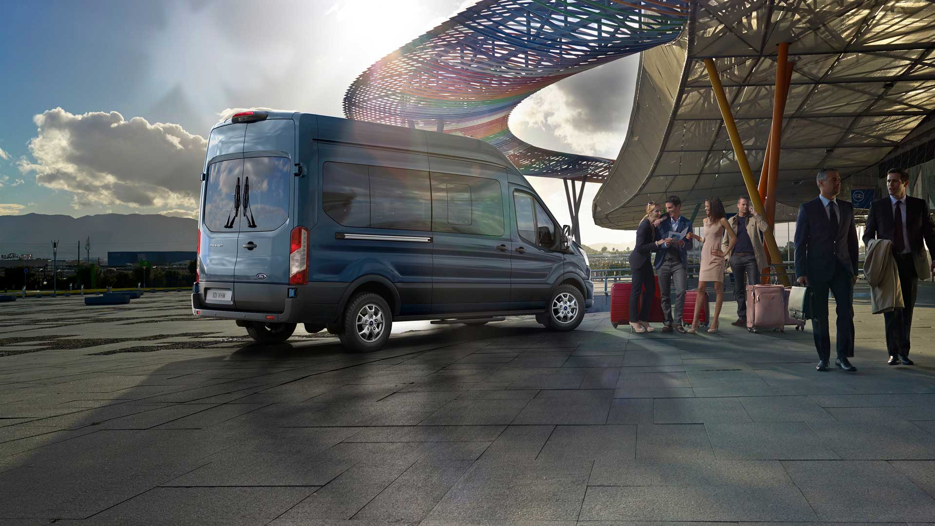 All New Ford Transit Minibus rear view parked outside airport