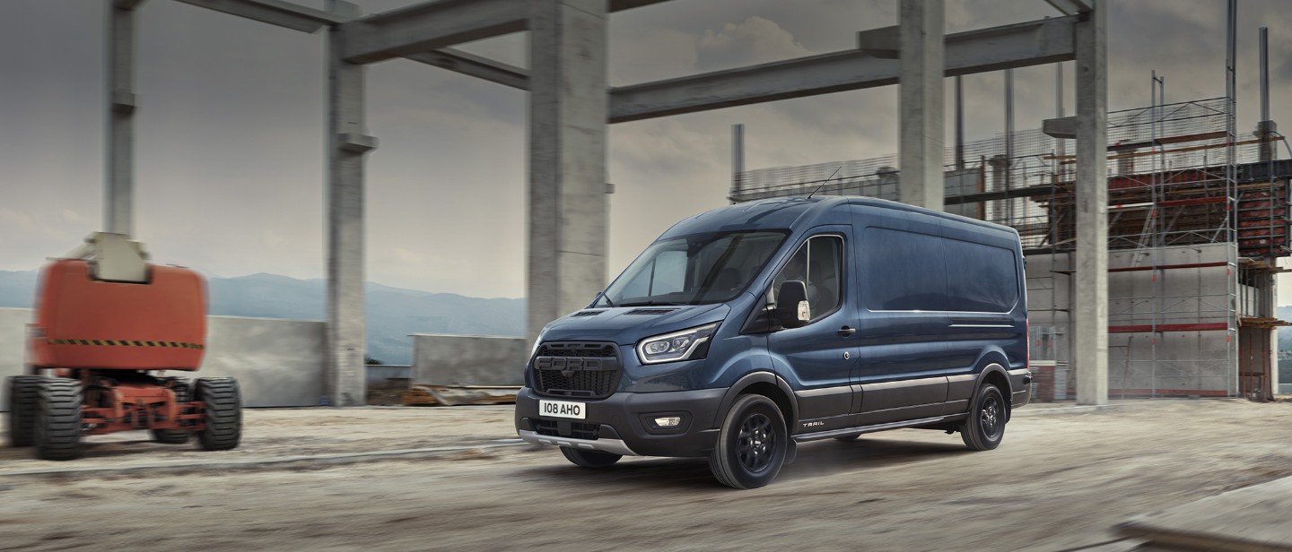 Blue Ford Transit Trail parked