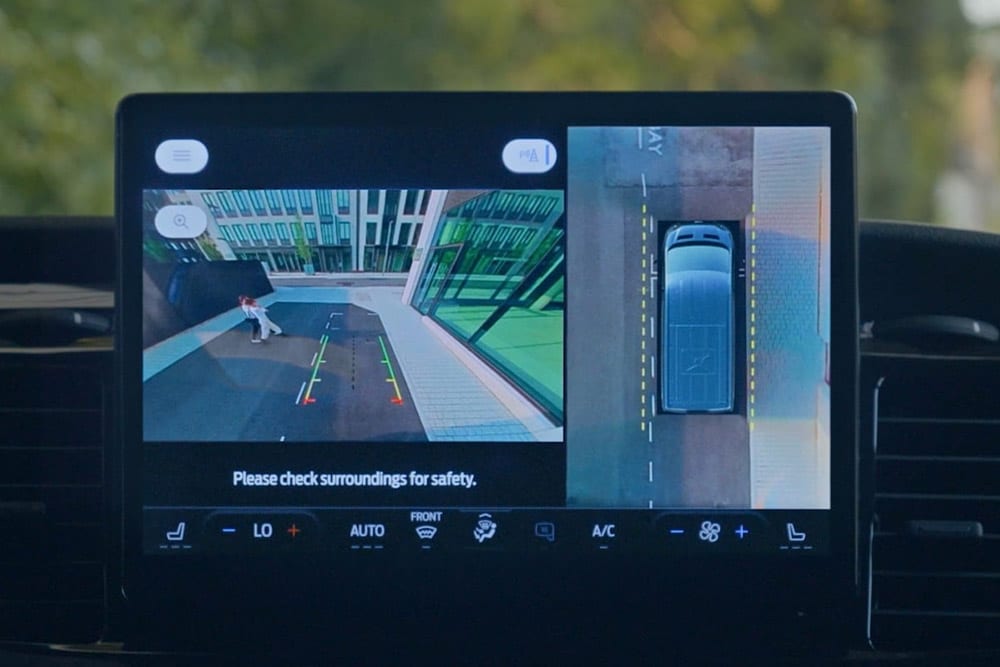 Dashboard screen displaying a top-down view of a Ford Transit van with a pedestrian.