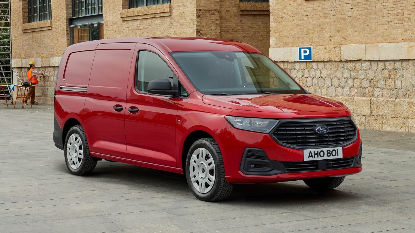 All-New Ford Transit Connect Trend in Maple Red showing front grille and automatic headlights. 