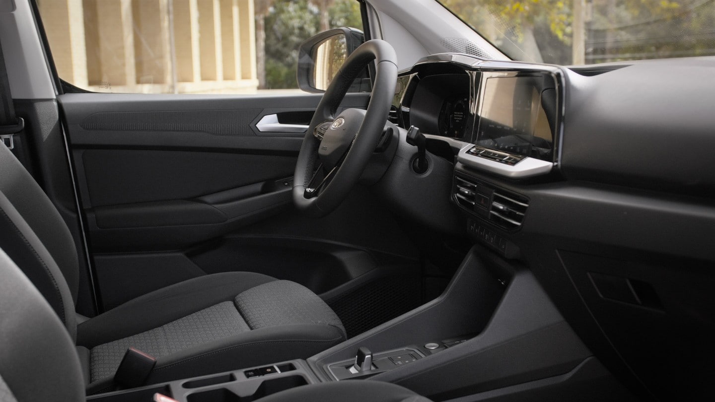 Driver’s seat of All-New Ford Transit Connect showing steering wheel and 10” touchscreen. 