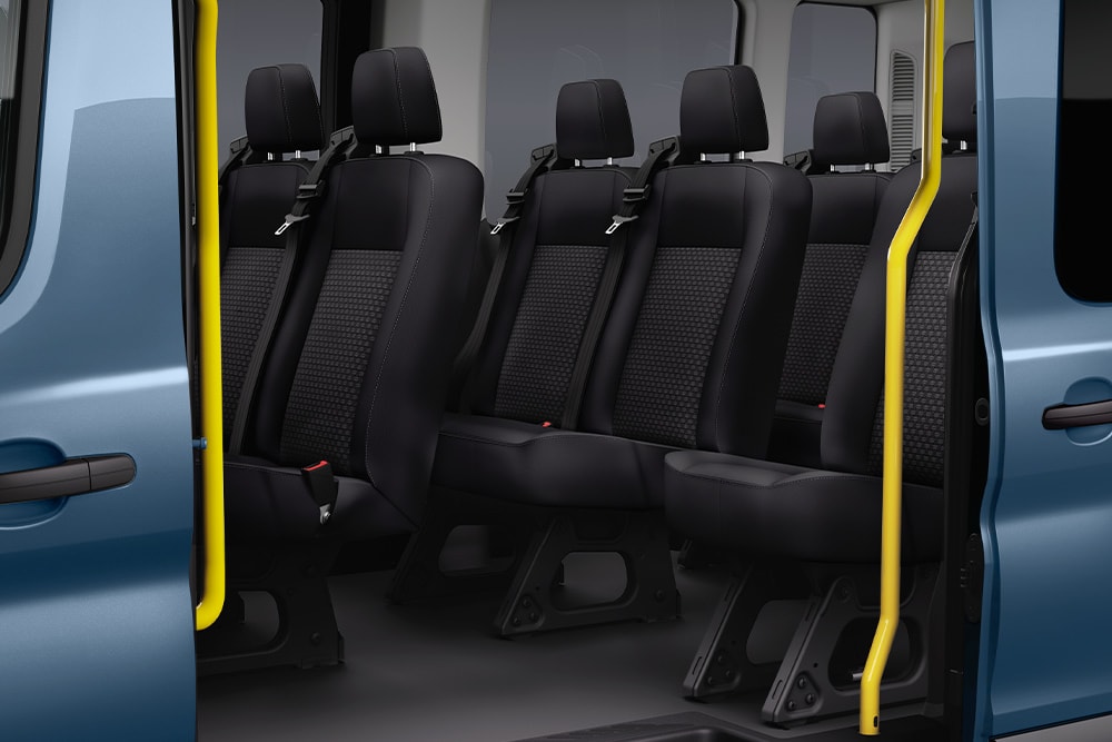  View of Ford Transit Kombi passenger seats through sliding side door.