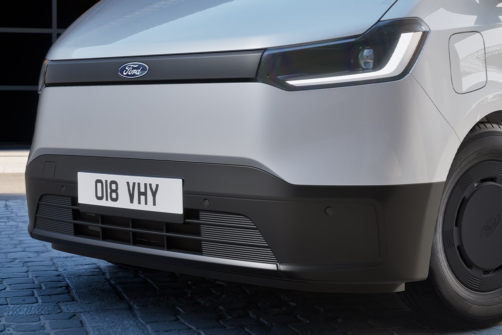 The front parking sensors on a silver All-New Ford Transit City® L2H2.