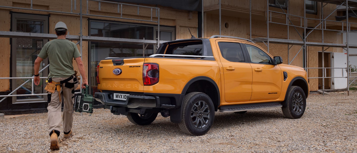 Ford Ranger parked by construction 3/4 rear view