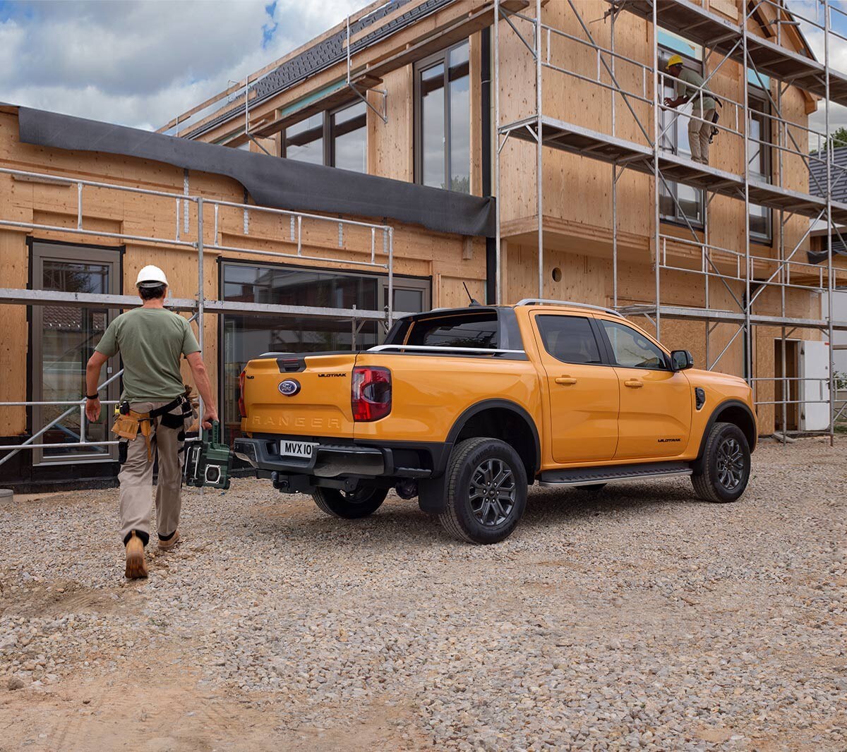 Ford Ranger parked by construction 3/4 rear view