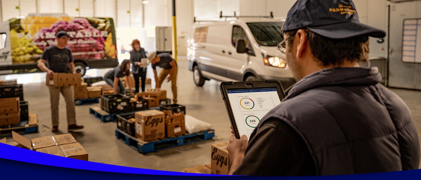 Man using Ford Pro intelligence in a warehouse