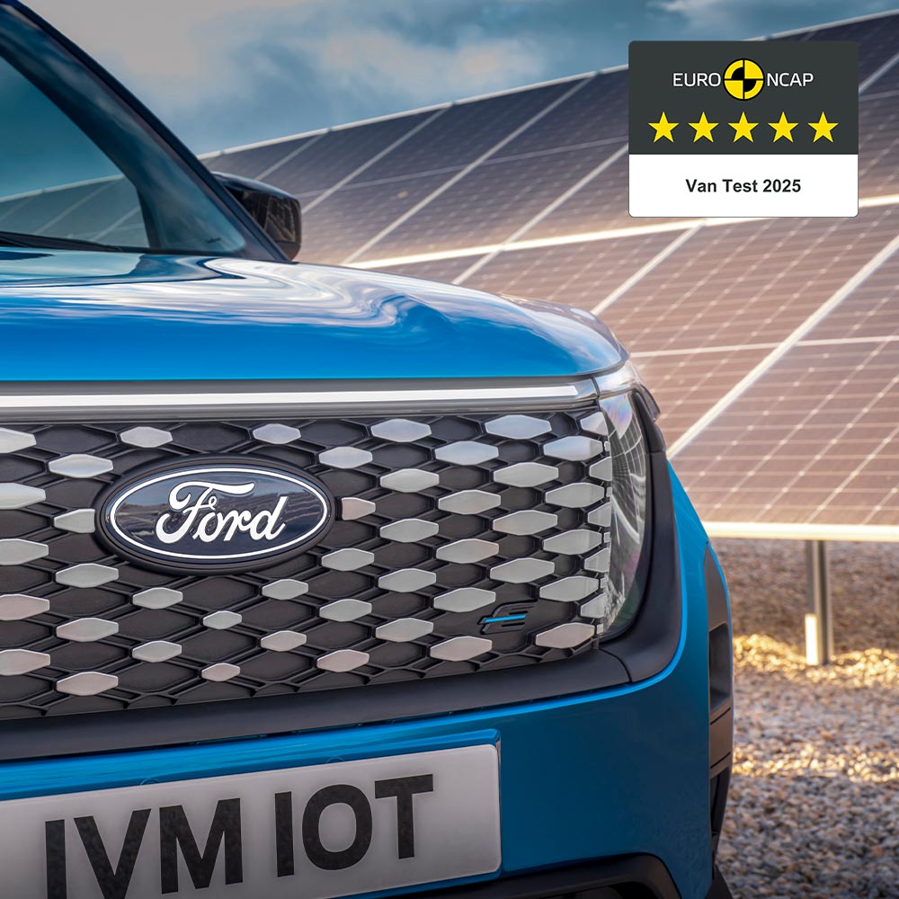 A blue Ford E-Transit Courier grille with a 5-star Euro NCAP safety rating and solar panels in the background