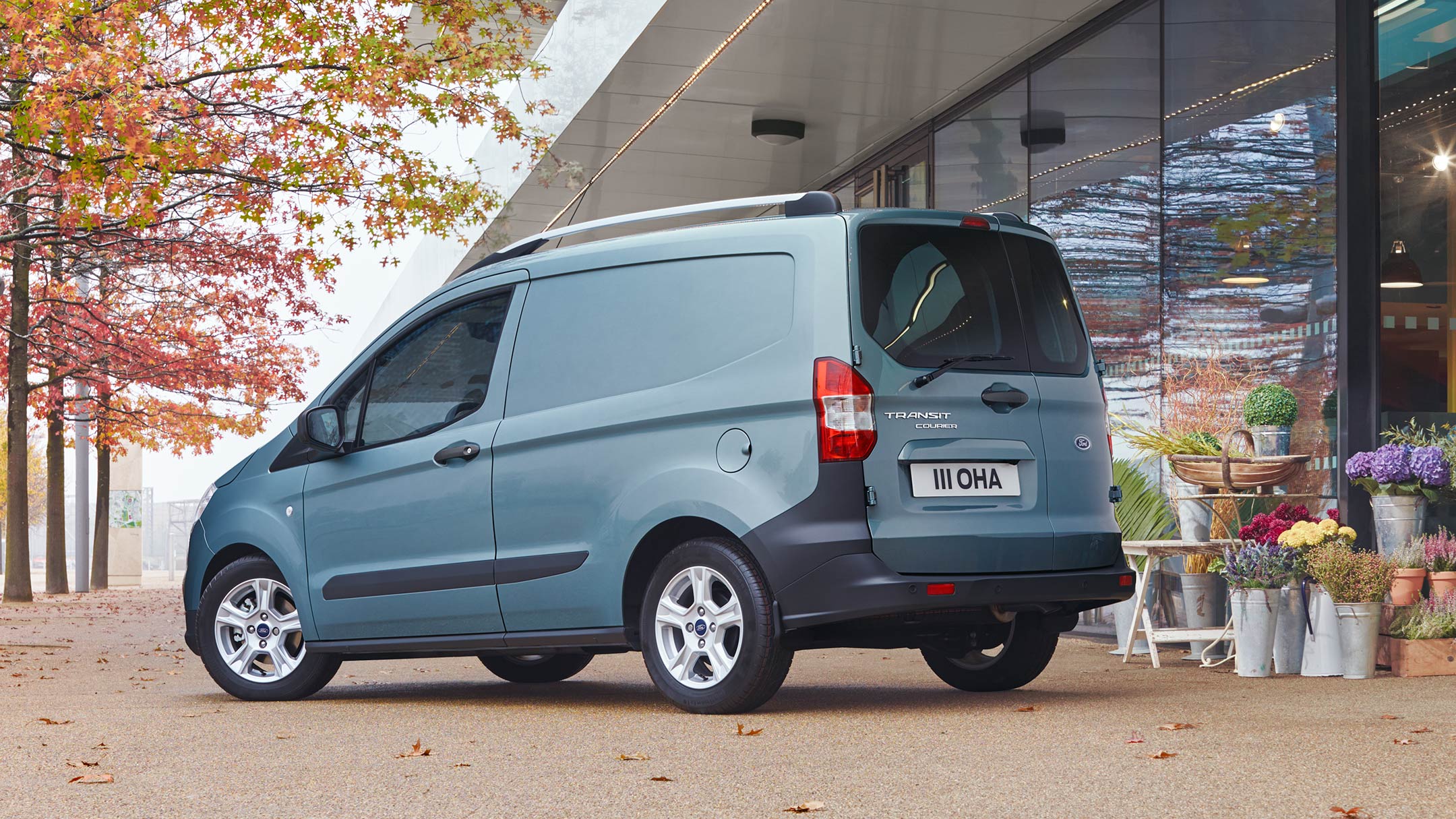 Ford Transit Courier parked next to florist store