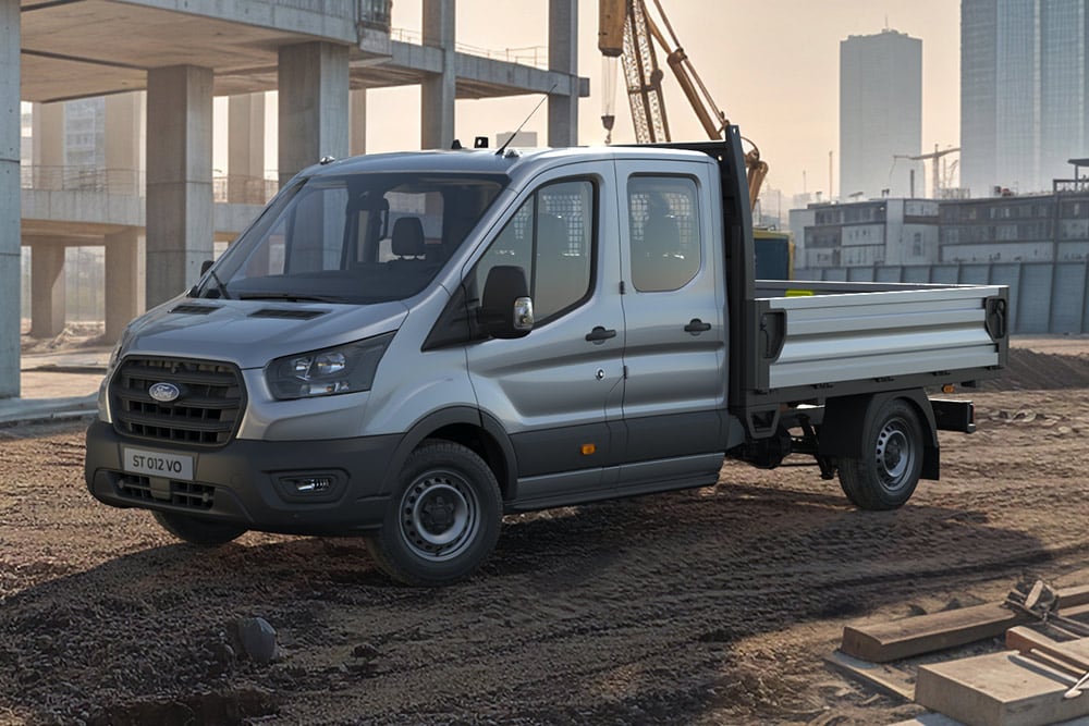 A white Ford E-Transit Skeletal Chassis parked on a construction site.