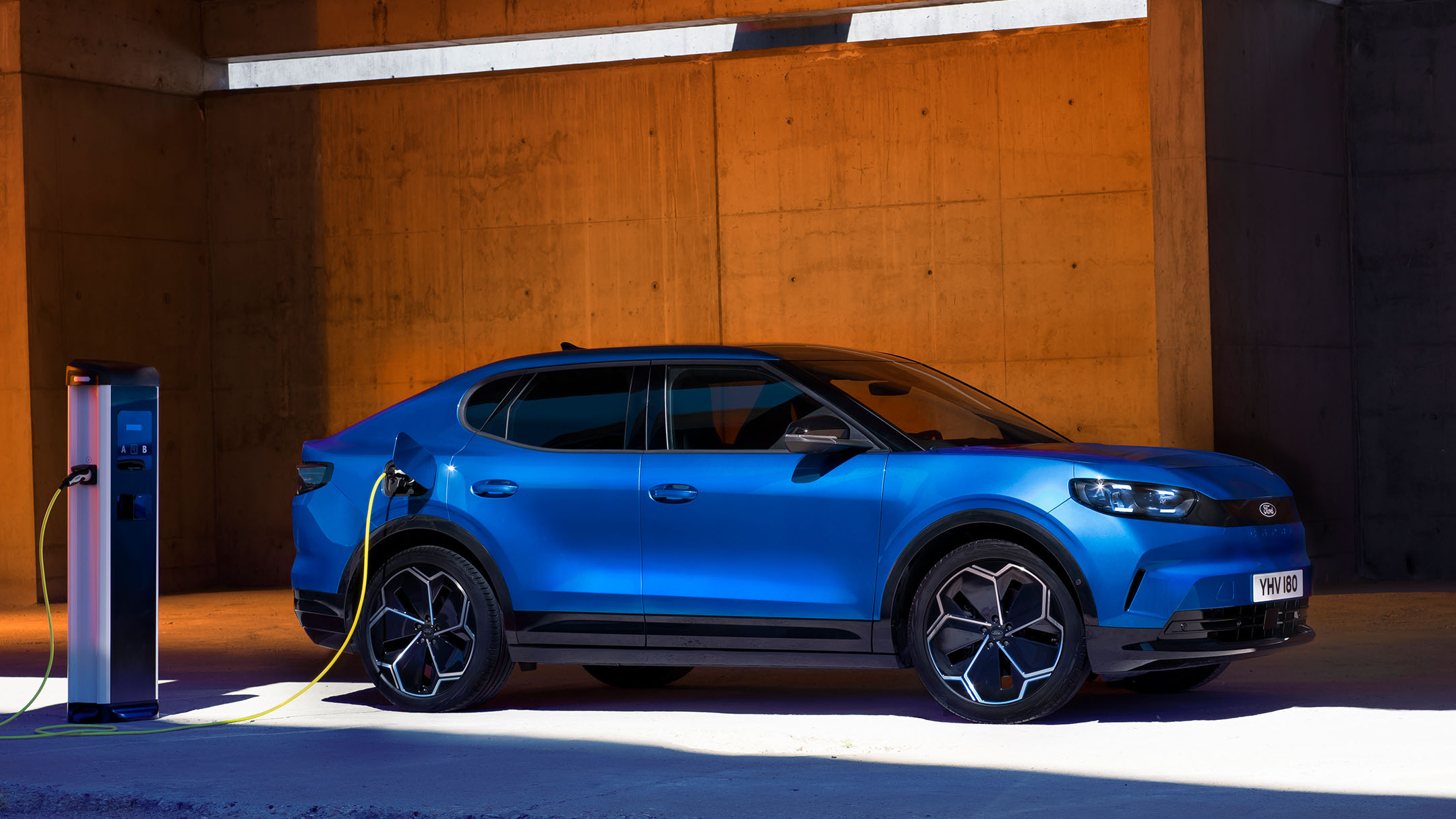 Ford Capri EV charging at a station