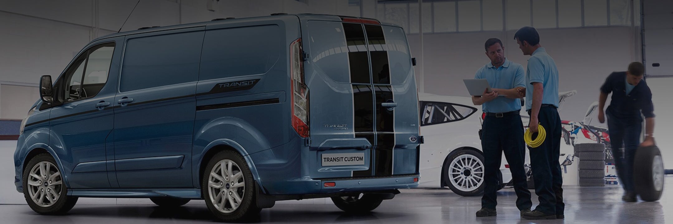 Ford Transit Custom being inspected by maintenance crew